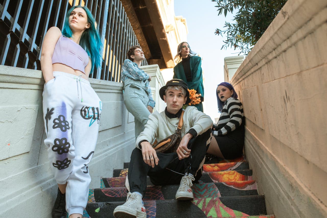 Group of People Sitting on Stairs